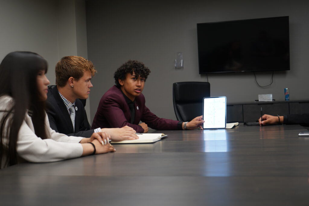 A sales professional sharing direct marketing solutions to his colleagues