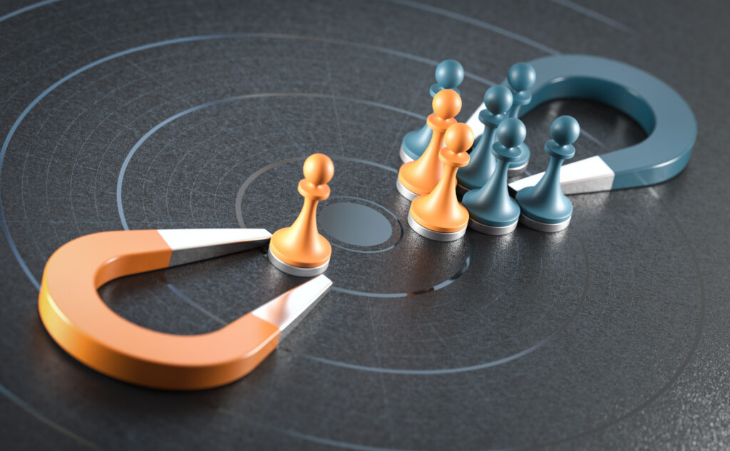 Two sets of magnets and chess pieces opposite each other, representing customer retention