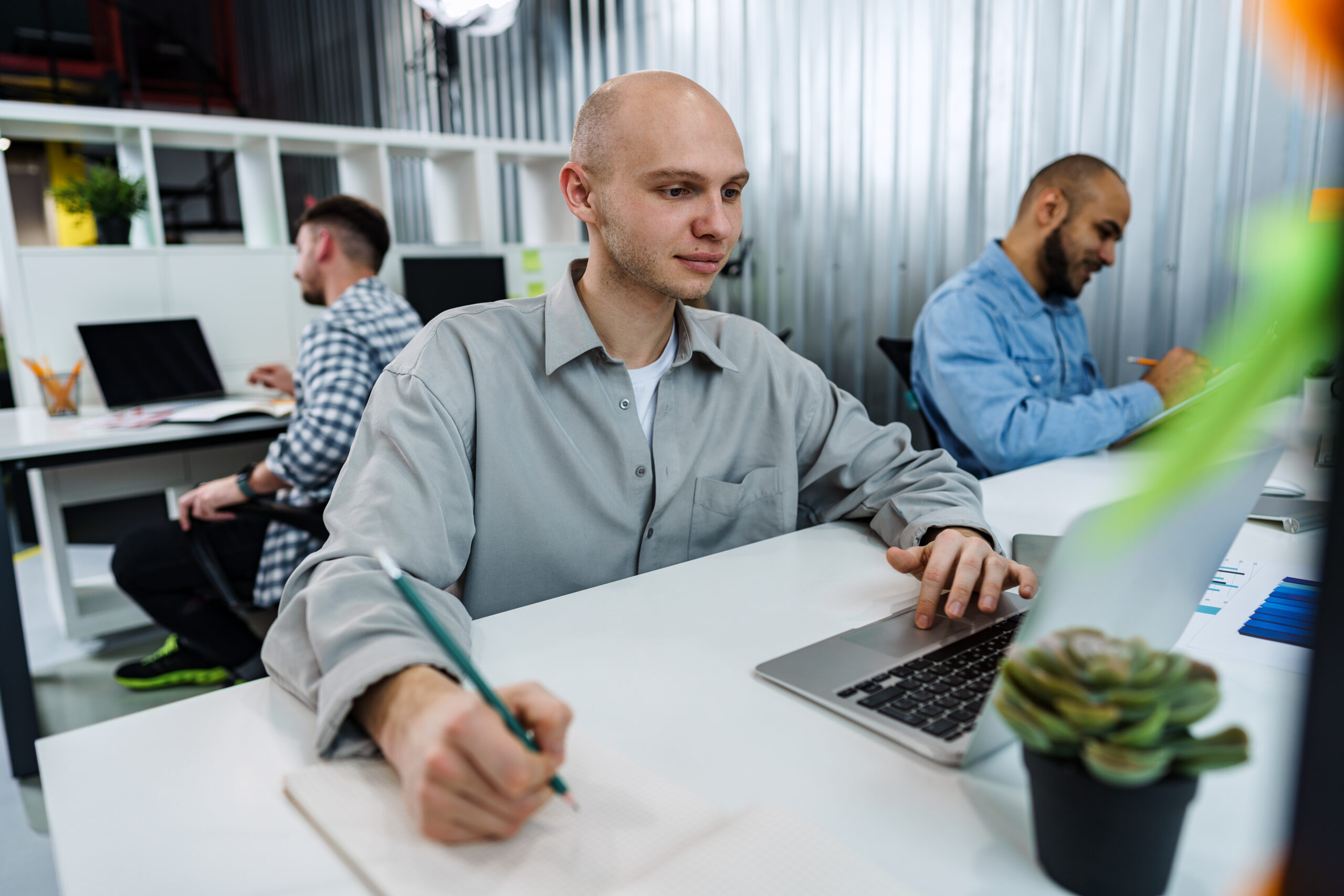 A professional with a full-time job, working in the office.